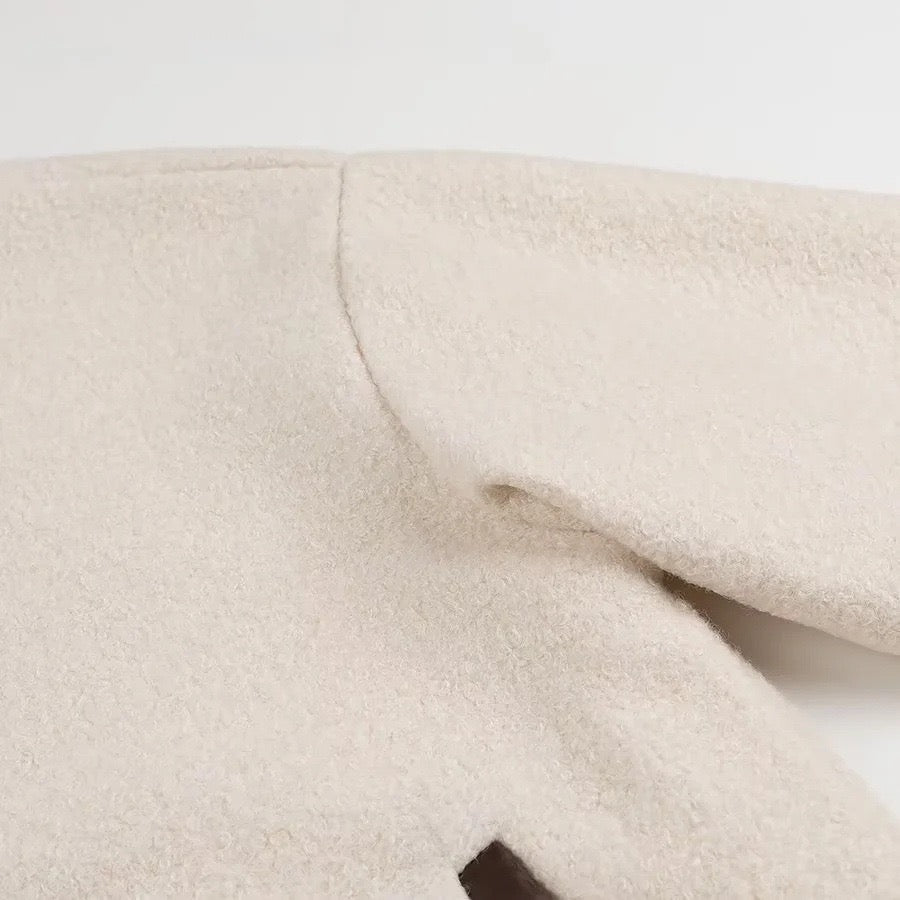 Veste en laine beige avec nœud