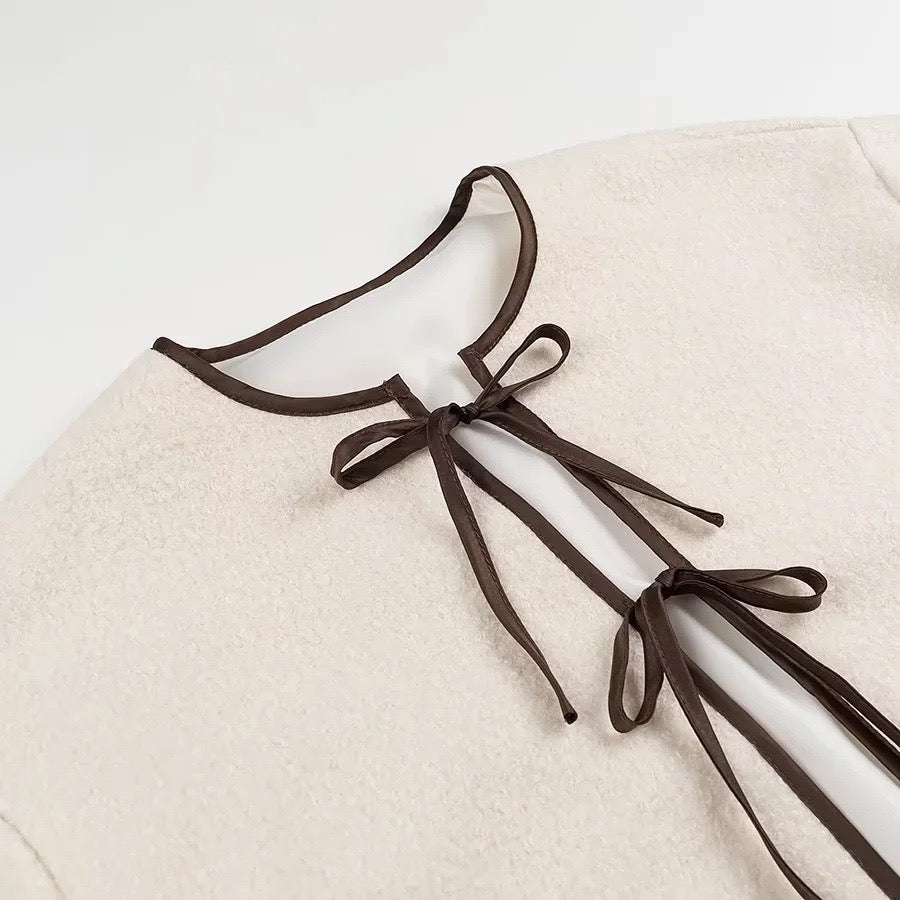 Veste en laine beige avec nœud
